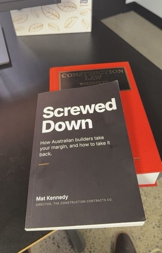 Screwed Down, paperback, on a desk